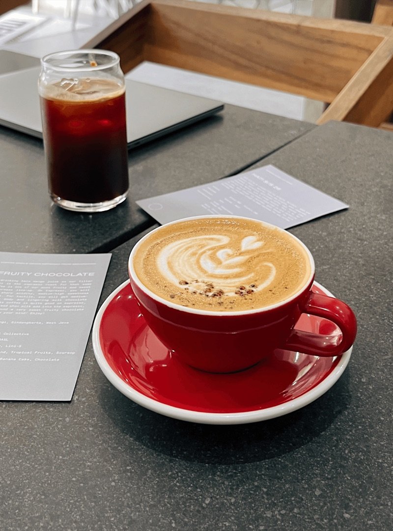 Latte and iced coffee on a café table